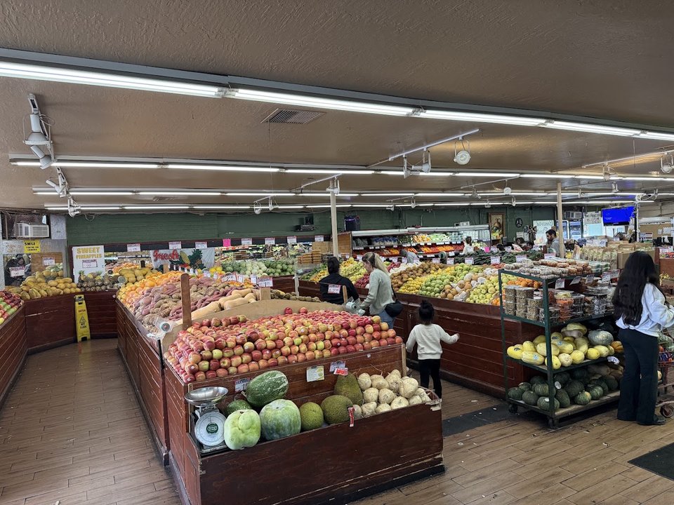 Local fruits and vegetables arranged in neat rows.