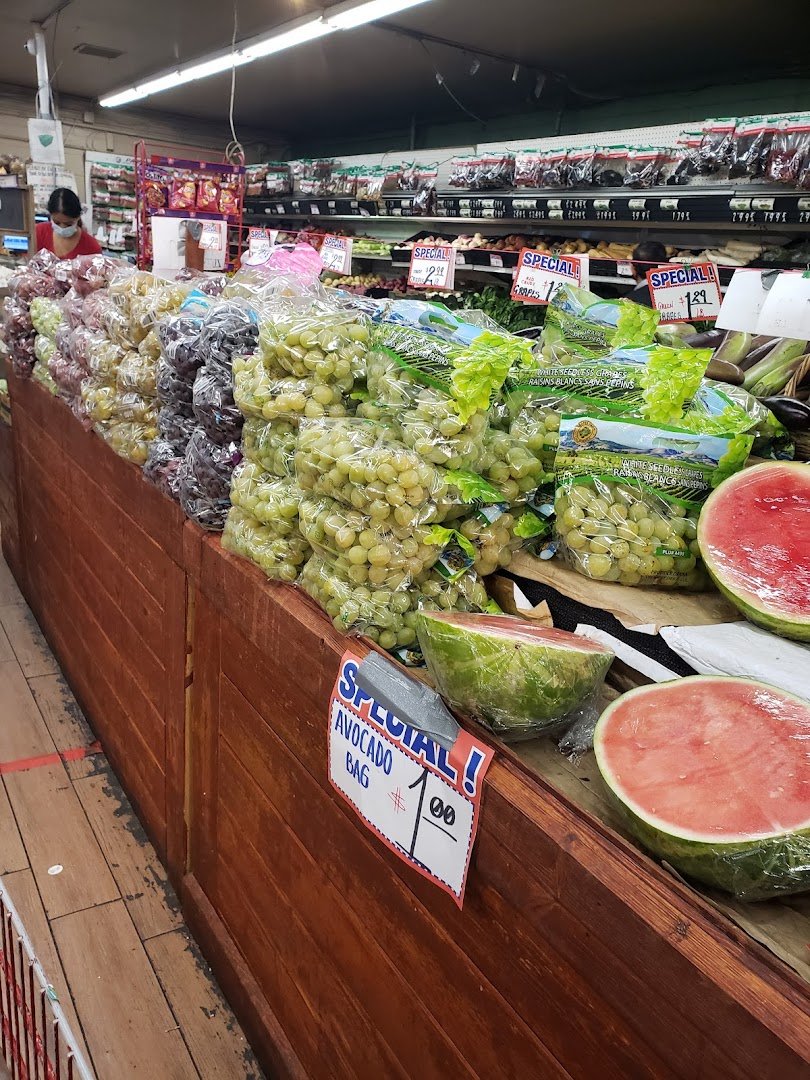 Fresh produce displayed inside an indoor market.